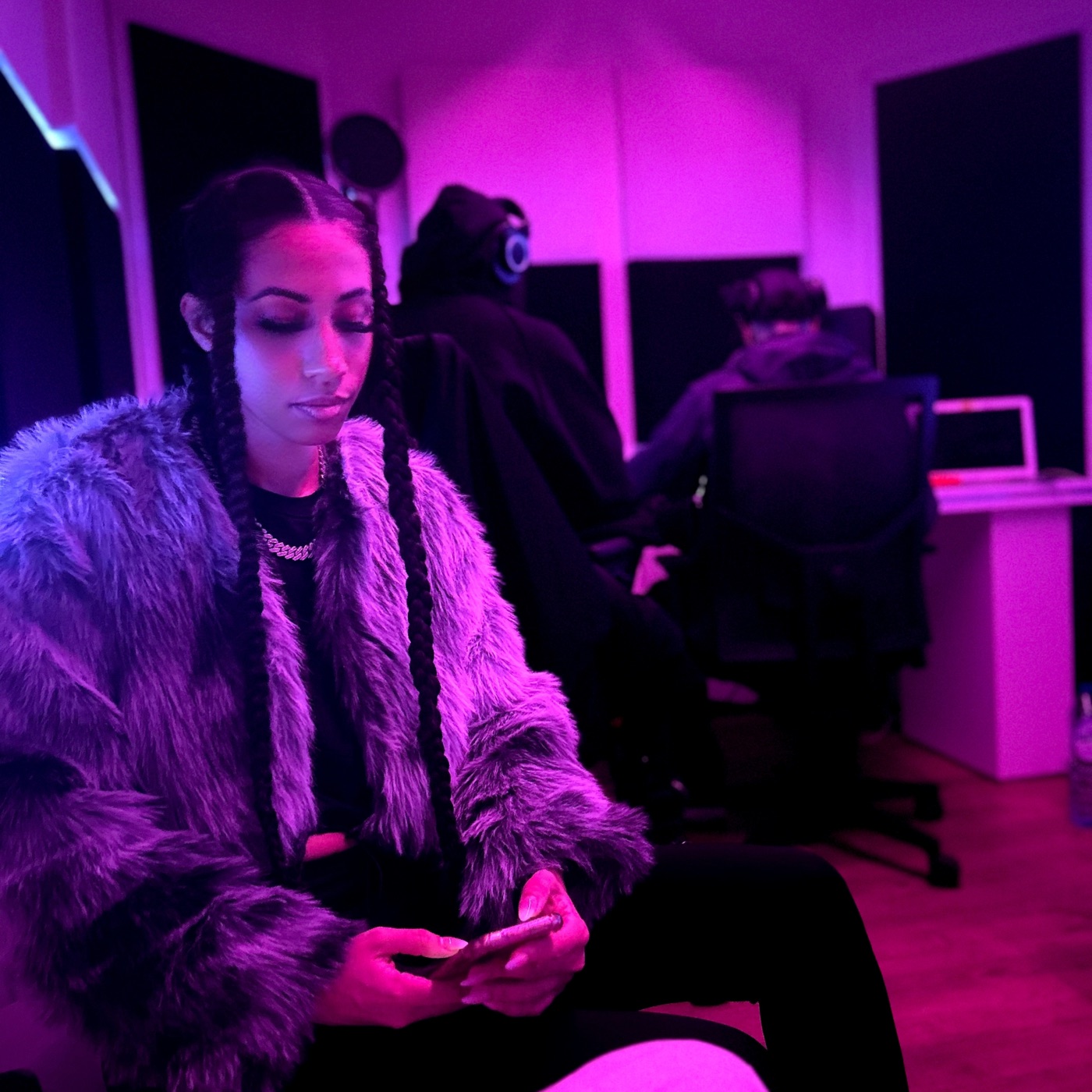FAAN in the recording studio under magenta lighting